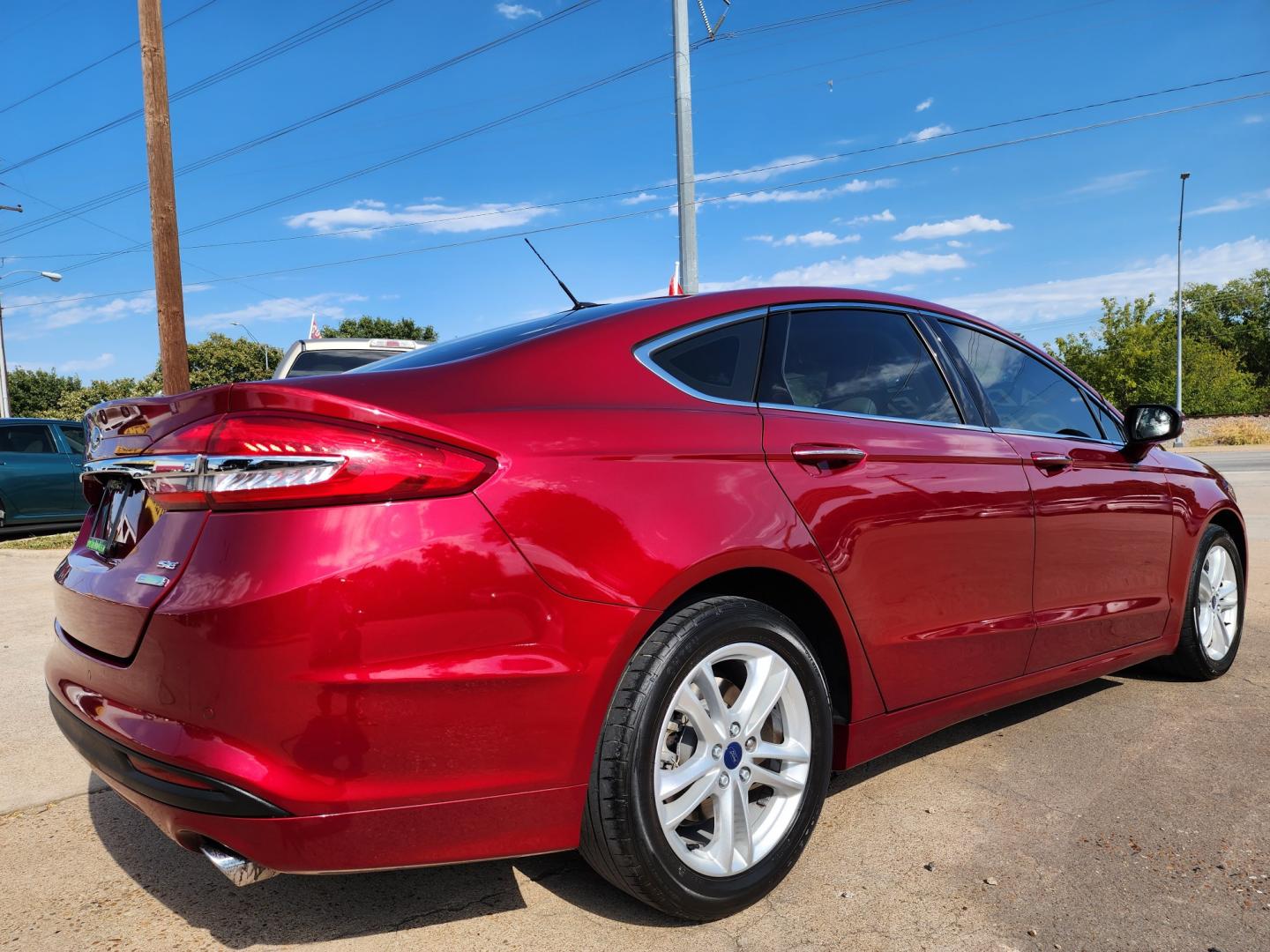 2018 RED Ford Fusion SE (3FA6P0HD2JR) with an 1.5L L4 DOHC 16V engine, 6A transmission, located at 2660 S.Garland Avenue, Garland, TX, 75041, (469) 298-3118, 32.885551, -96.655602 - Welcome to DallasAutos4Less, one of the Premier BUY HERE PAY HERE Dealers in the North Dallas Area. We specialize in financing to people with NO CREDIT or BAD CREDIT. We need proof of income, proof of residence, and a ID. Come buy your new car from us today!! This is a SUPER CLEAN 2018 FORD FUSIO - Photo#3